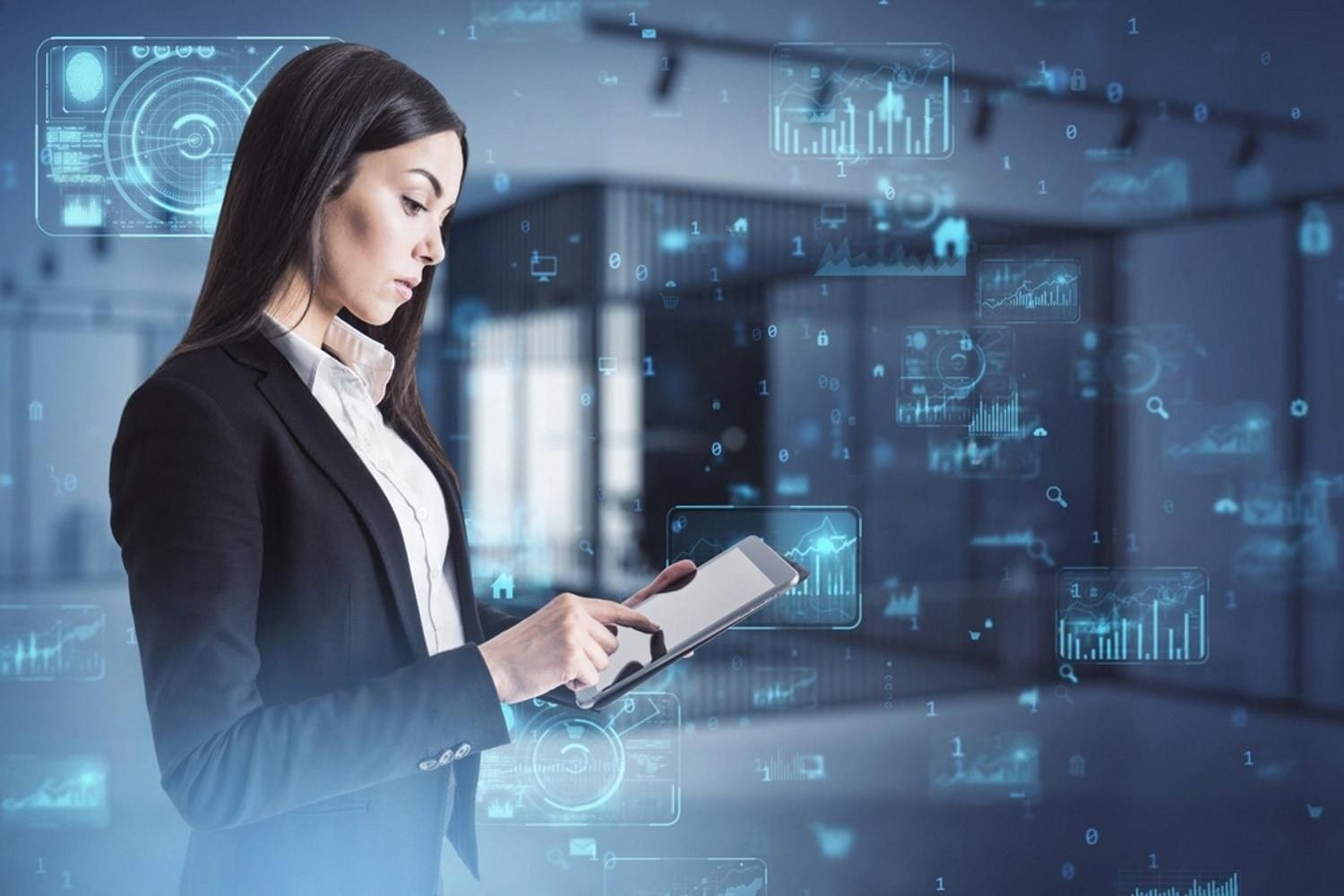 Businesswoman in a Dubai office using a tablet with AI-powered analytics dashboards